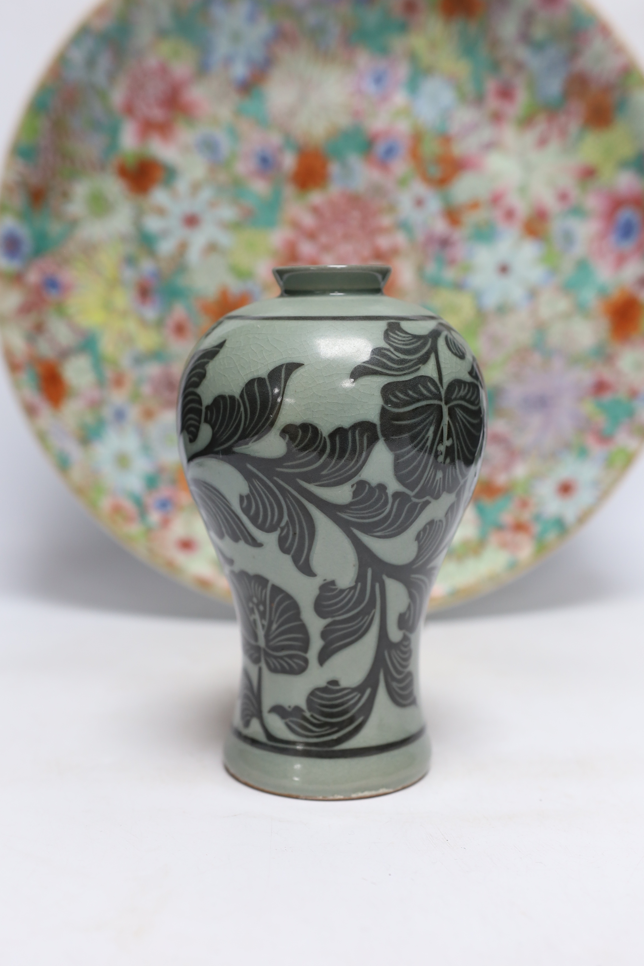 A Chinese millefleur enamelled porcelain dish, six character Qianlong seal mark, but late 19th/early 20th century, 38cm diameter and a Korean celadon vase